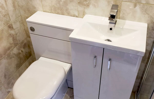 Modern toilet and sink with high quality tiling